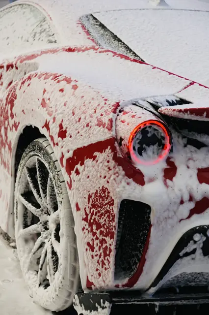 Ferrari 488 Pista under the snow foam